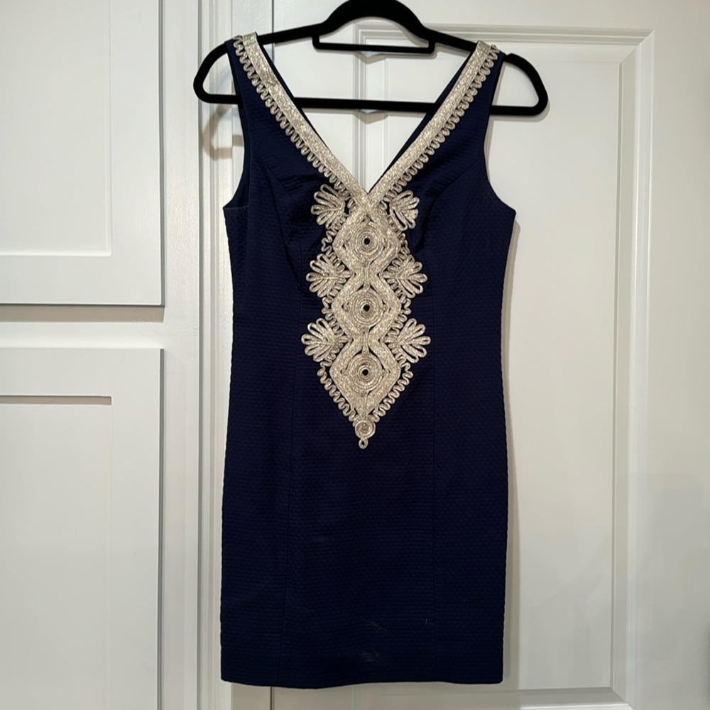 Navy dress with gold accents.